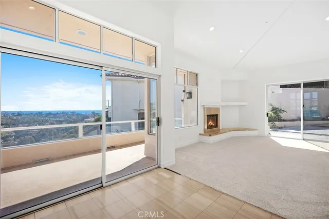 a kitchen with a sink white cabinets and white appliances