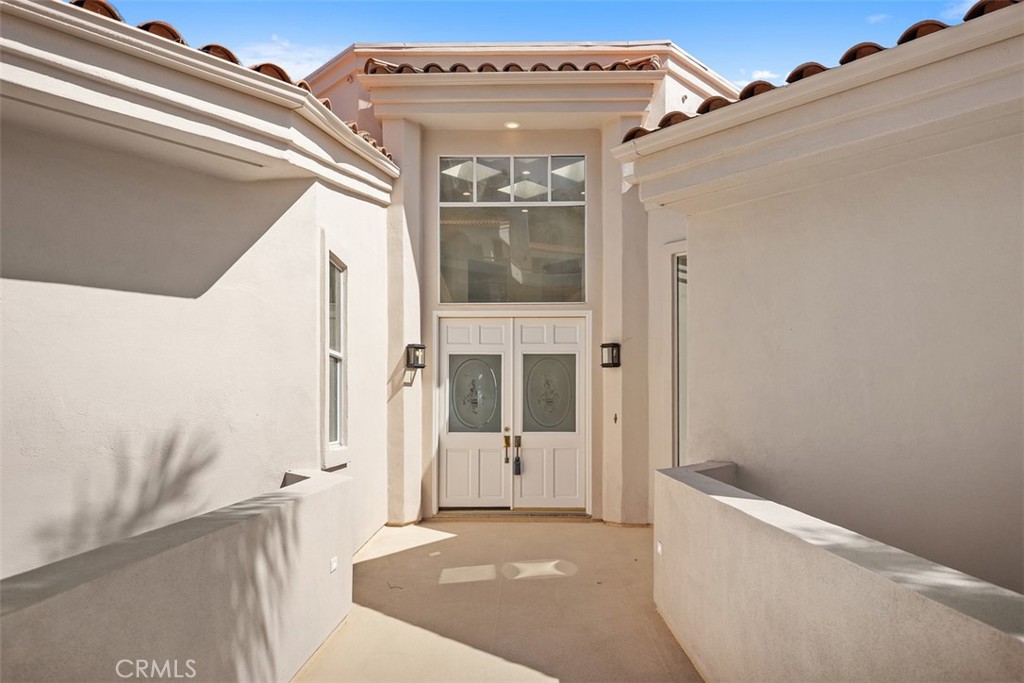 4 Tesoro San Clemente, CA 92673 - Photo 2 of 60 a view of a hallway with wooden floor and entryway