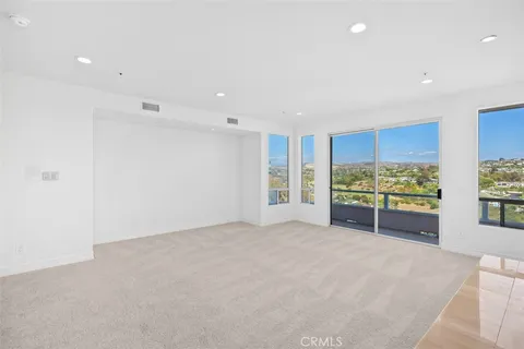 a bedroom with a large bed and a large window