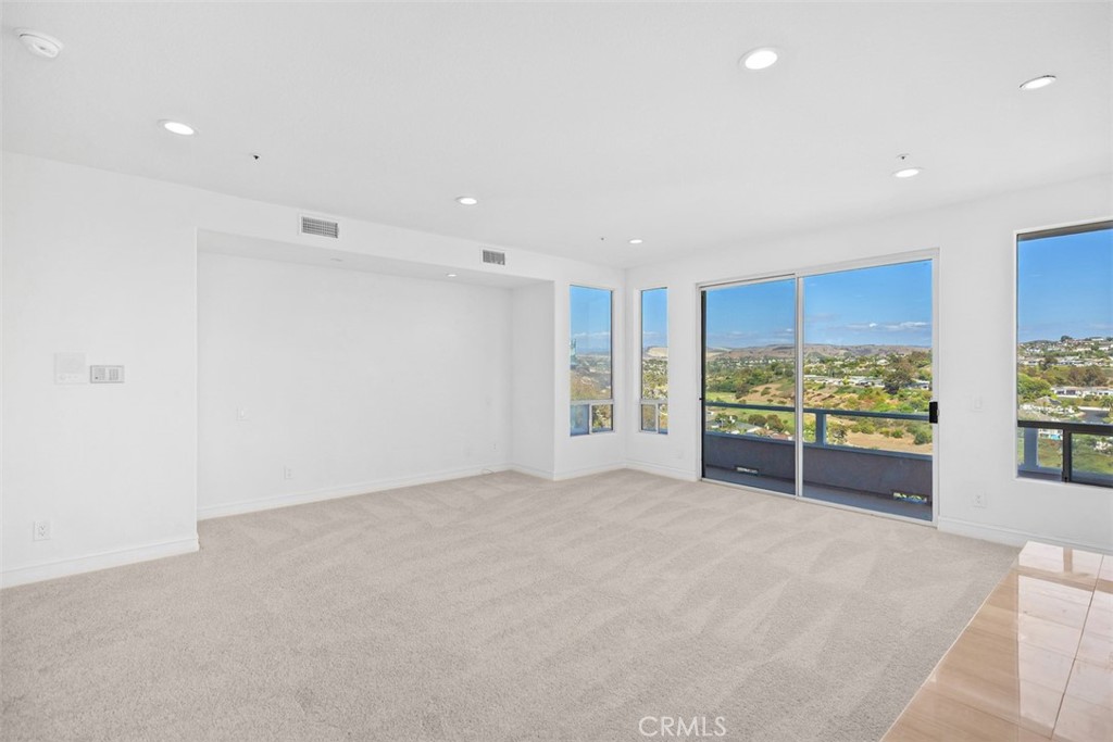 4 Tesoro San Clemente, CA 92673 - Photo 25 of 60 a view of an empty room with a large window and front door