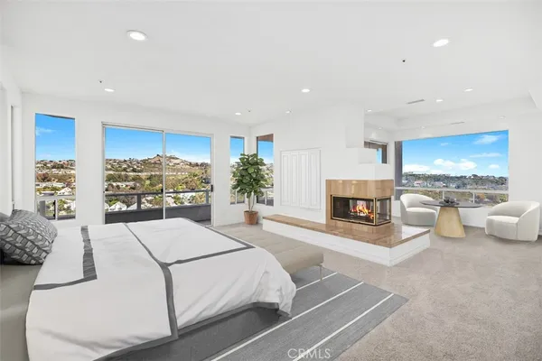 a living room with furniture and a kitchen