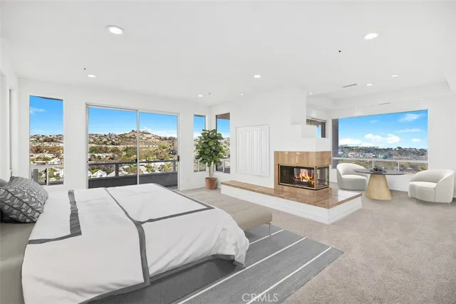 a living room with furniture and a kitchen