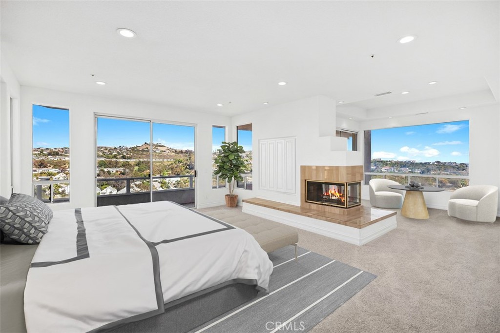 4 Tesoro San Clemente, CA 92673 - Photo 27 of 60 a living room with furniture and a fireplace