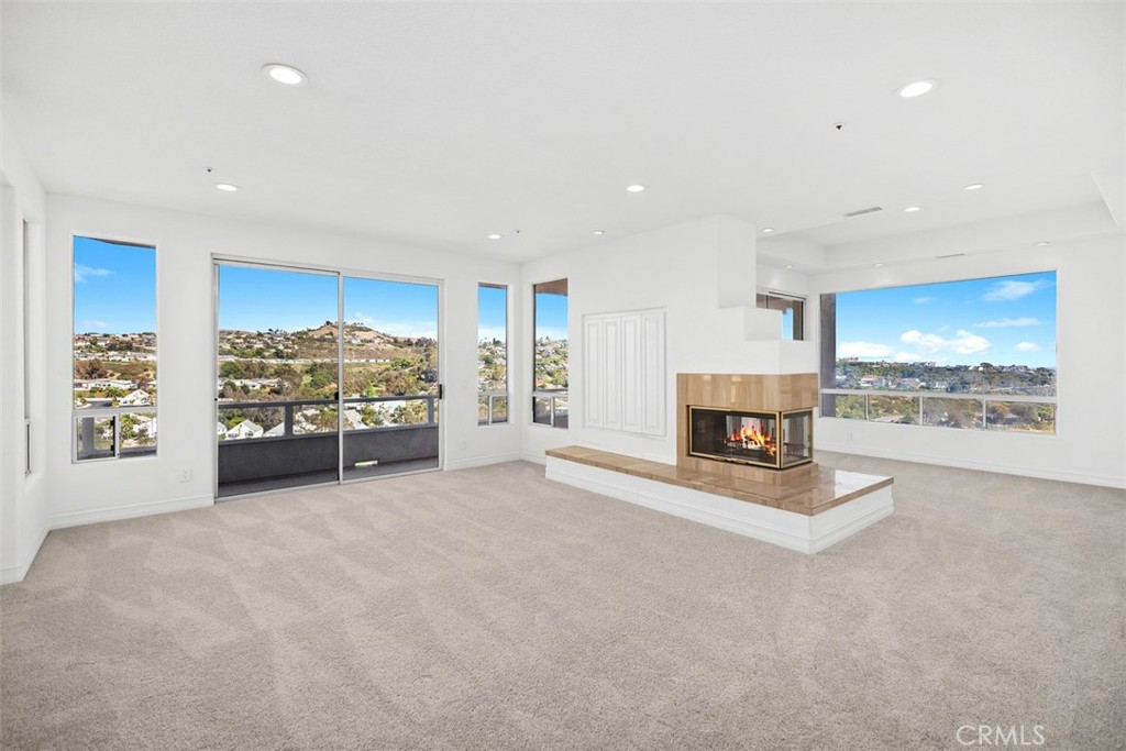 4 Tesoro San Clemente, CA 92673 - Photo 29 of 60 a view of a livingroom with a fireplace cabinet and window