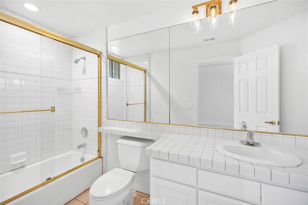 4 Tesoro San Clemente, CA 92673 - Photo 37 of 60 a bathroom with a sink a toilet and shower