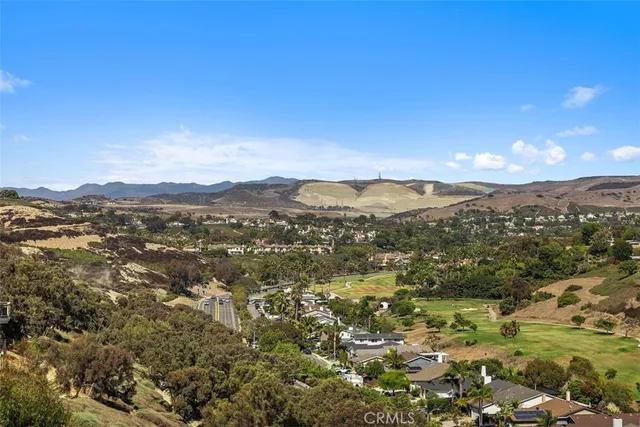 a view of a house with sitting area and garden