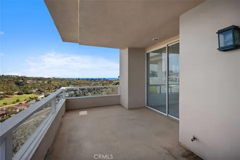 a view of a patio with couches and table and chairs with wooden floor and fence