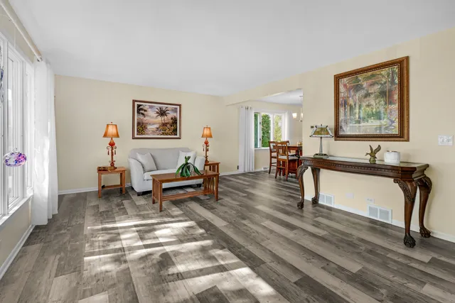 a living room with furniture and a table