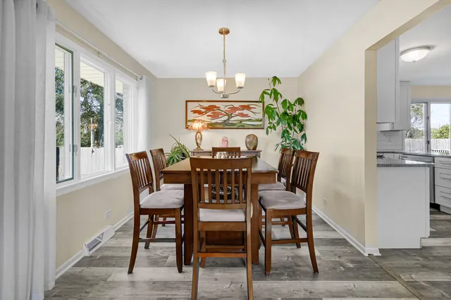 a view of a dining room with furniture window and outside view