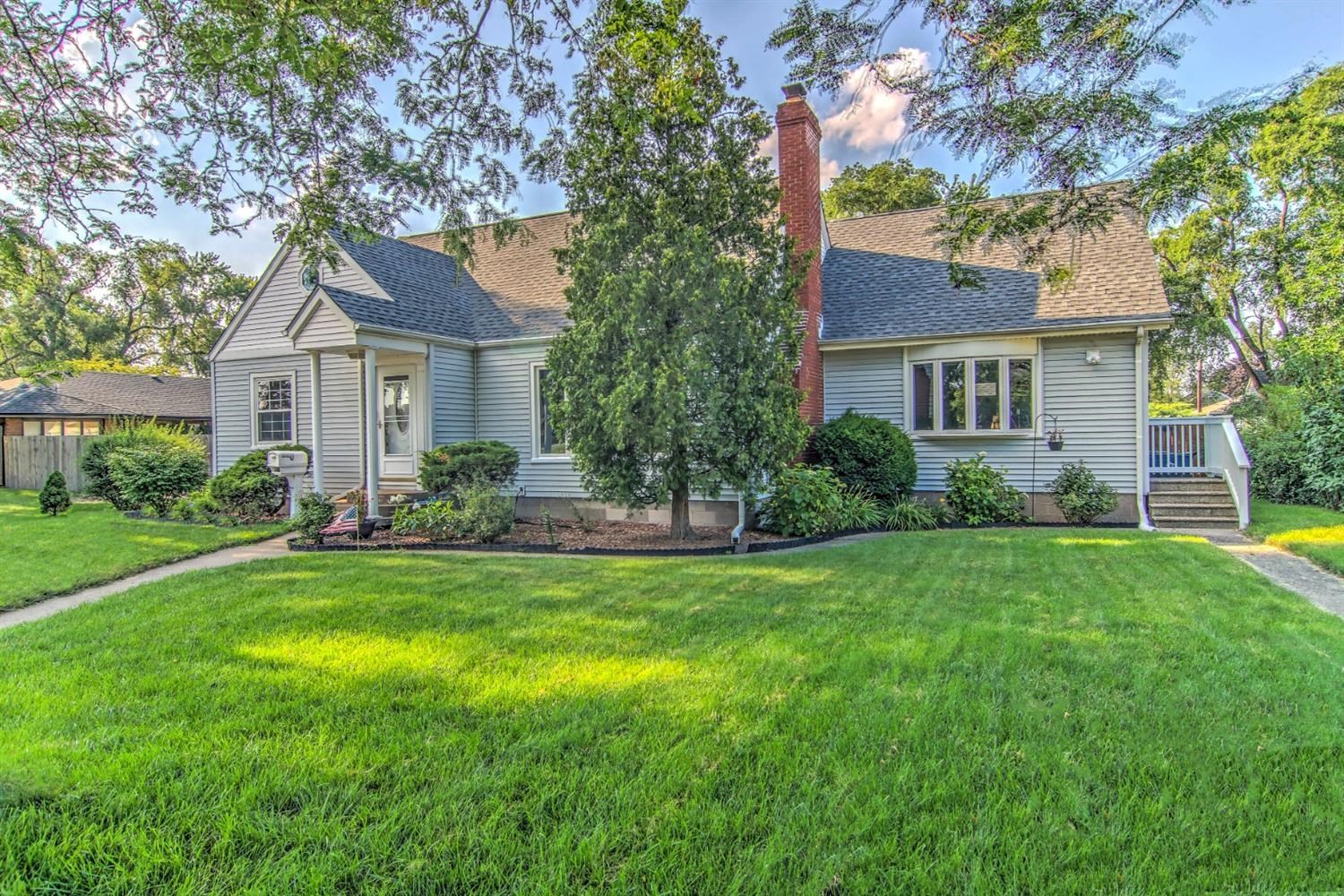 3115 Ridge Road Highland, IN 46322 - Photo 1 of 33 a front view of a house with a yard and trees