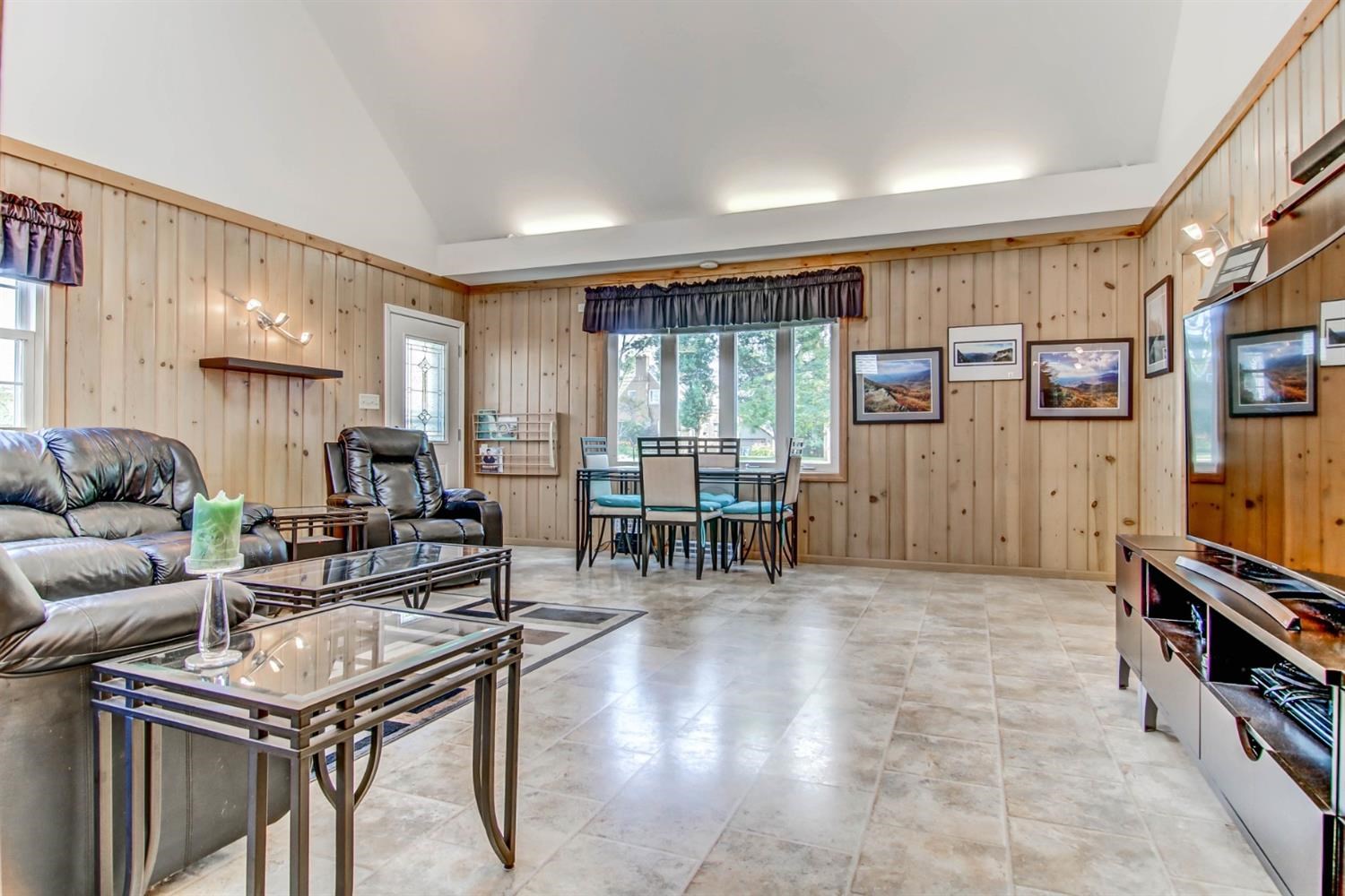 3115 Ridge Road Highland, IN 46322 - Photo 12 of 33 a living room with furniture a dining table and a large window