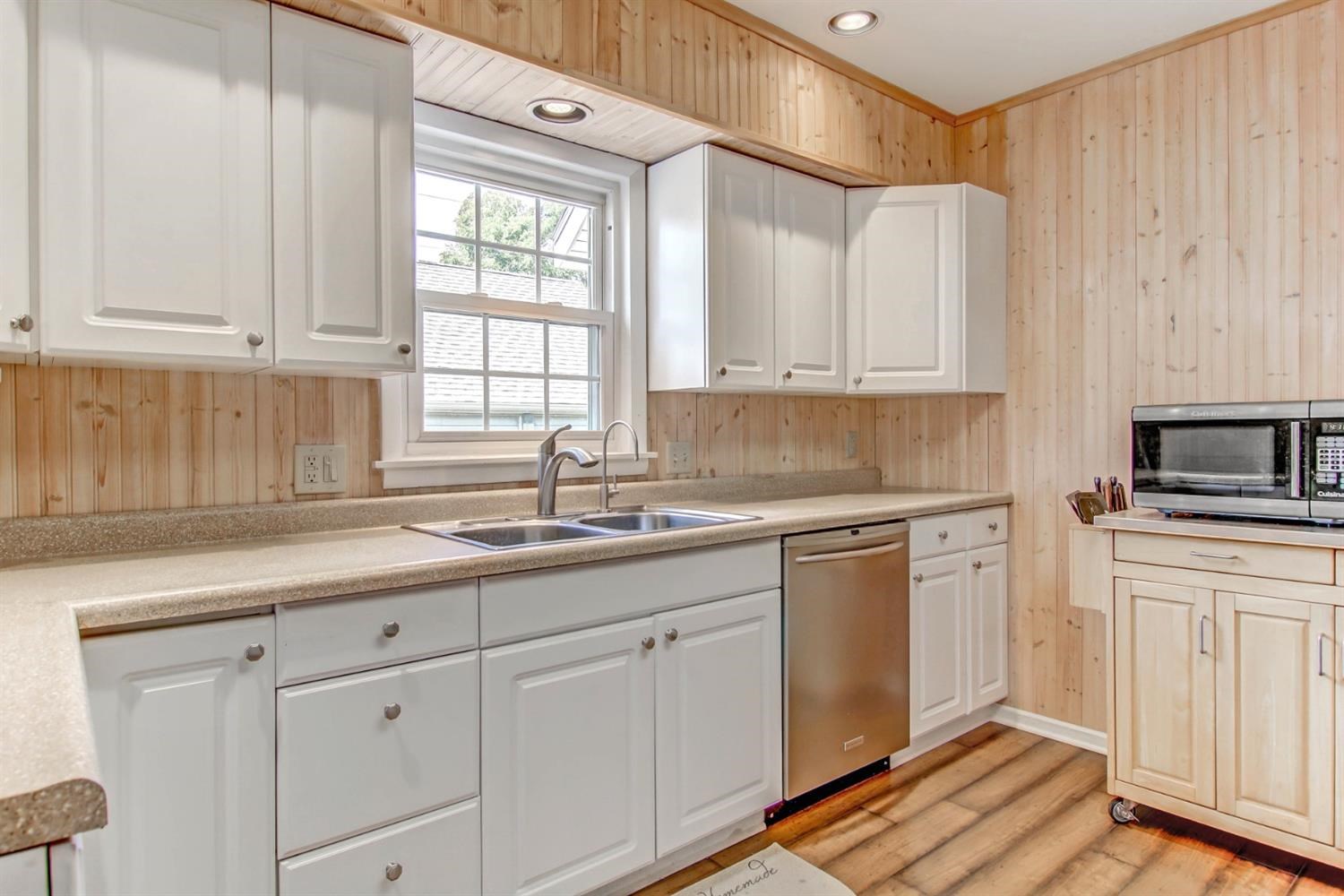 3115 Ridge Road Highland, IN 46322 - Photo 17 of 33 a kitchen with white cabinets and white appliances
