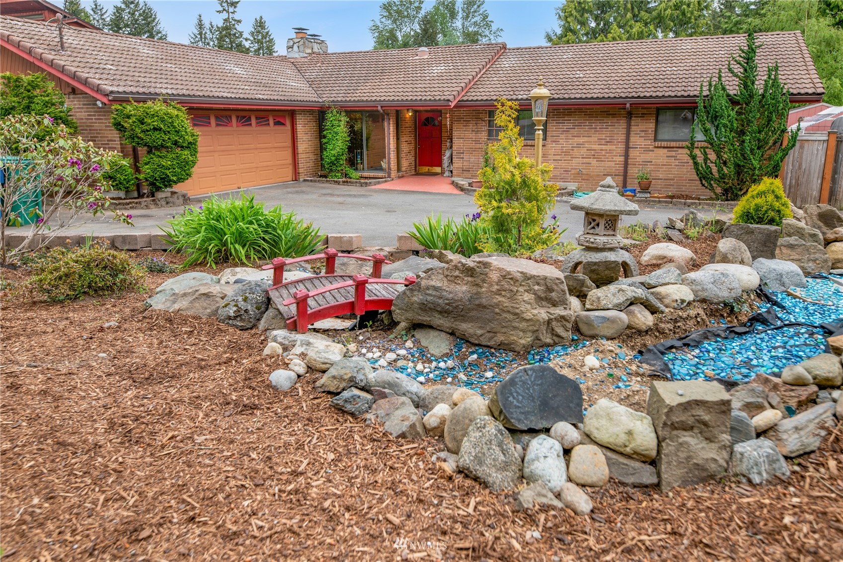 17315 Clover Road Bothell, WA 98012 - Photo 2 of 24 a front view of a house with garden