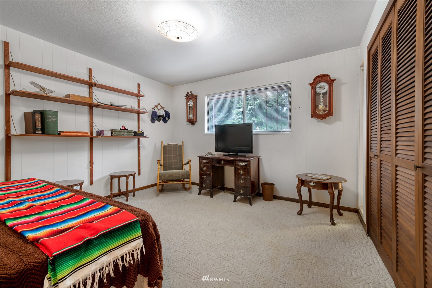 17315 Clover Road Bothell, WA 98012 - Photo 23 of 24 a bedroom with a bed and a chair in it
