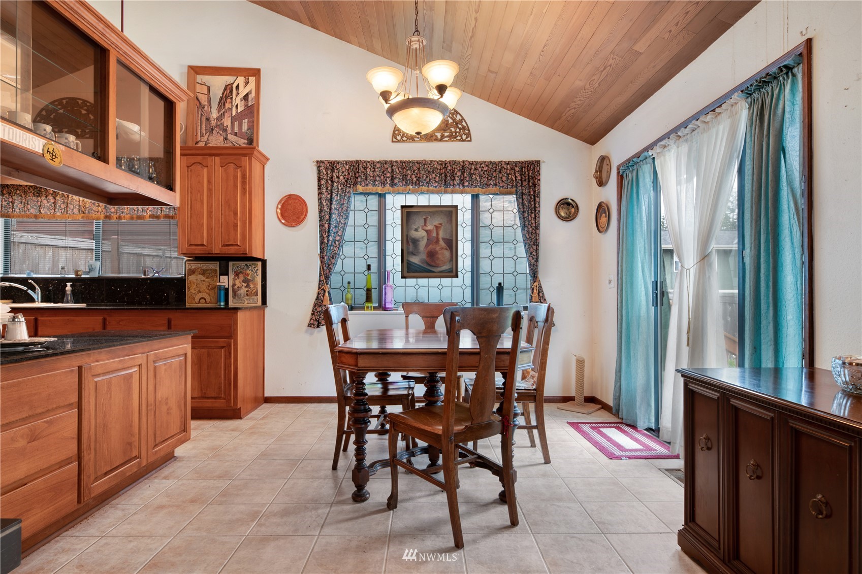 17315 Clover Road Bothell, WA 98012 - Photo 5 of 24 a view of a dining room with furniture window and wooden floor