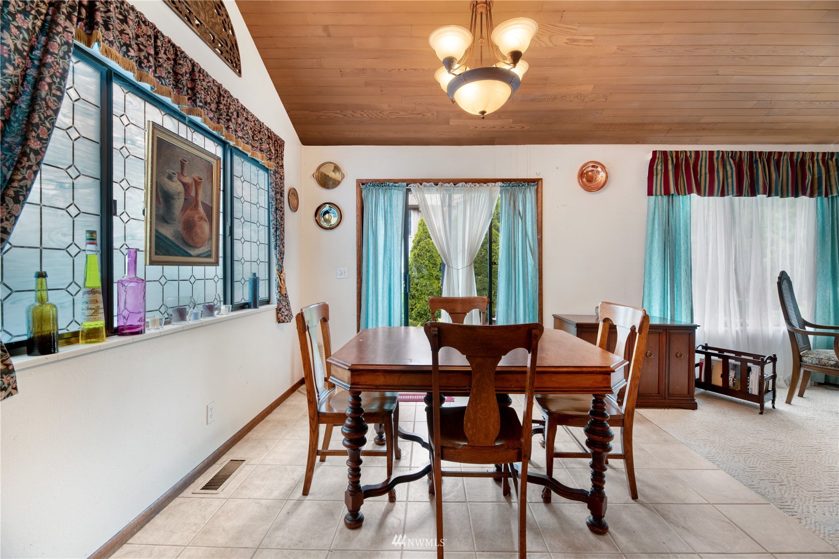 17315 Clover Road Bothell, WA 98012 - Photo 6 of 24 a view of a dining room with furniture window and outside view