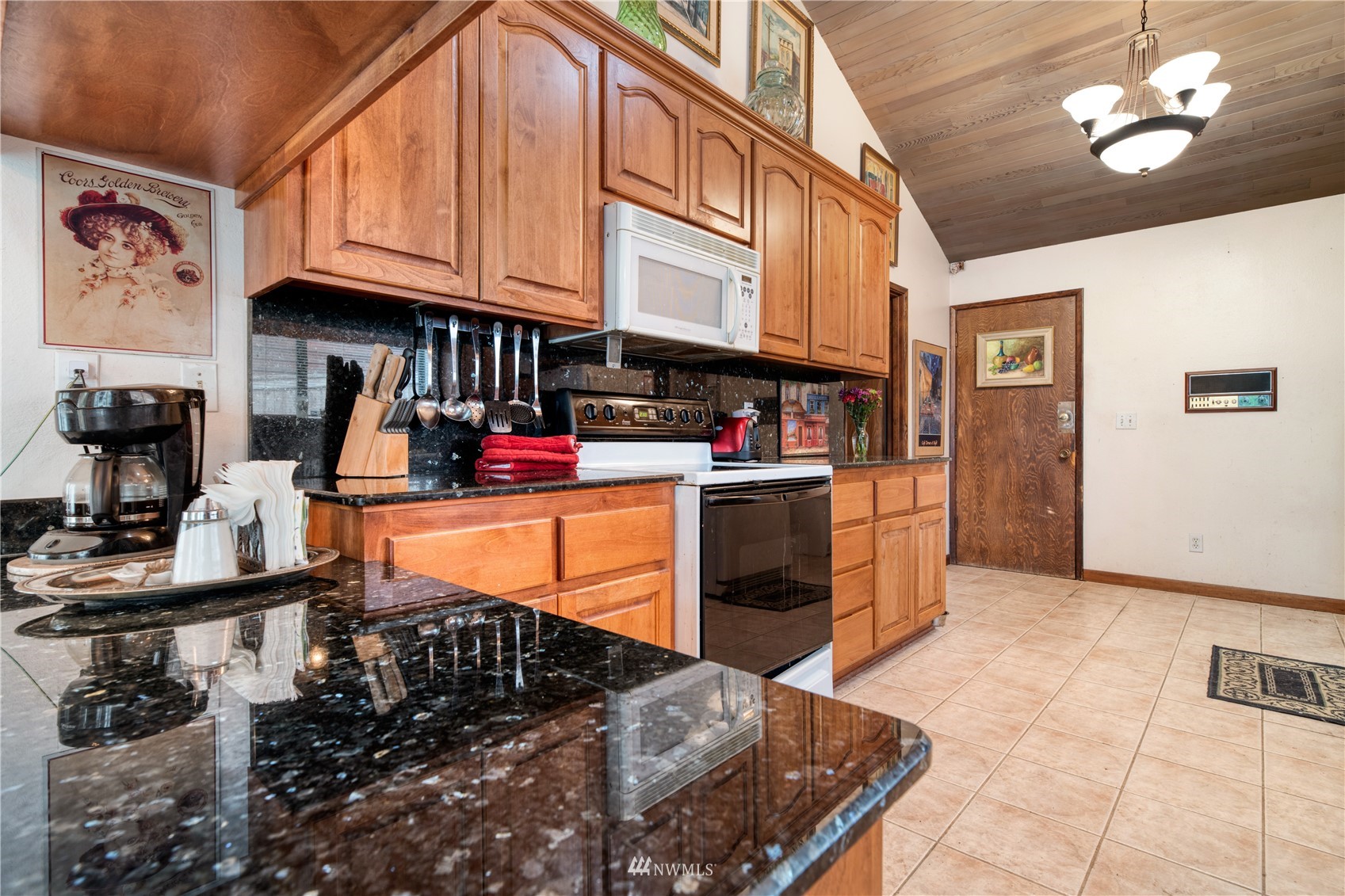 17315 Clover Road Bothell, WA 98012 - Photo 8 of 24 a kitchen with stainless steel appliances granite countertop a stove and cabinets