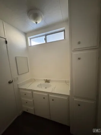 a bathroom with a sink and vanity