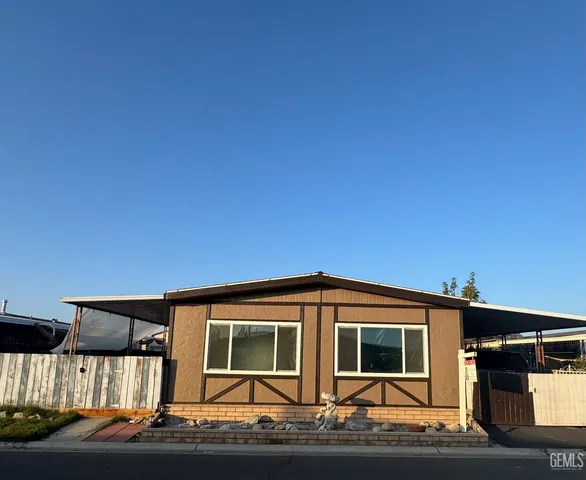 a front view of a house with yard