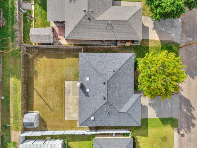 an aerial view of a house with swimming pool
