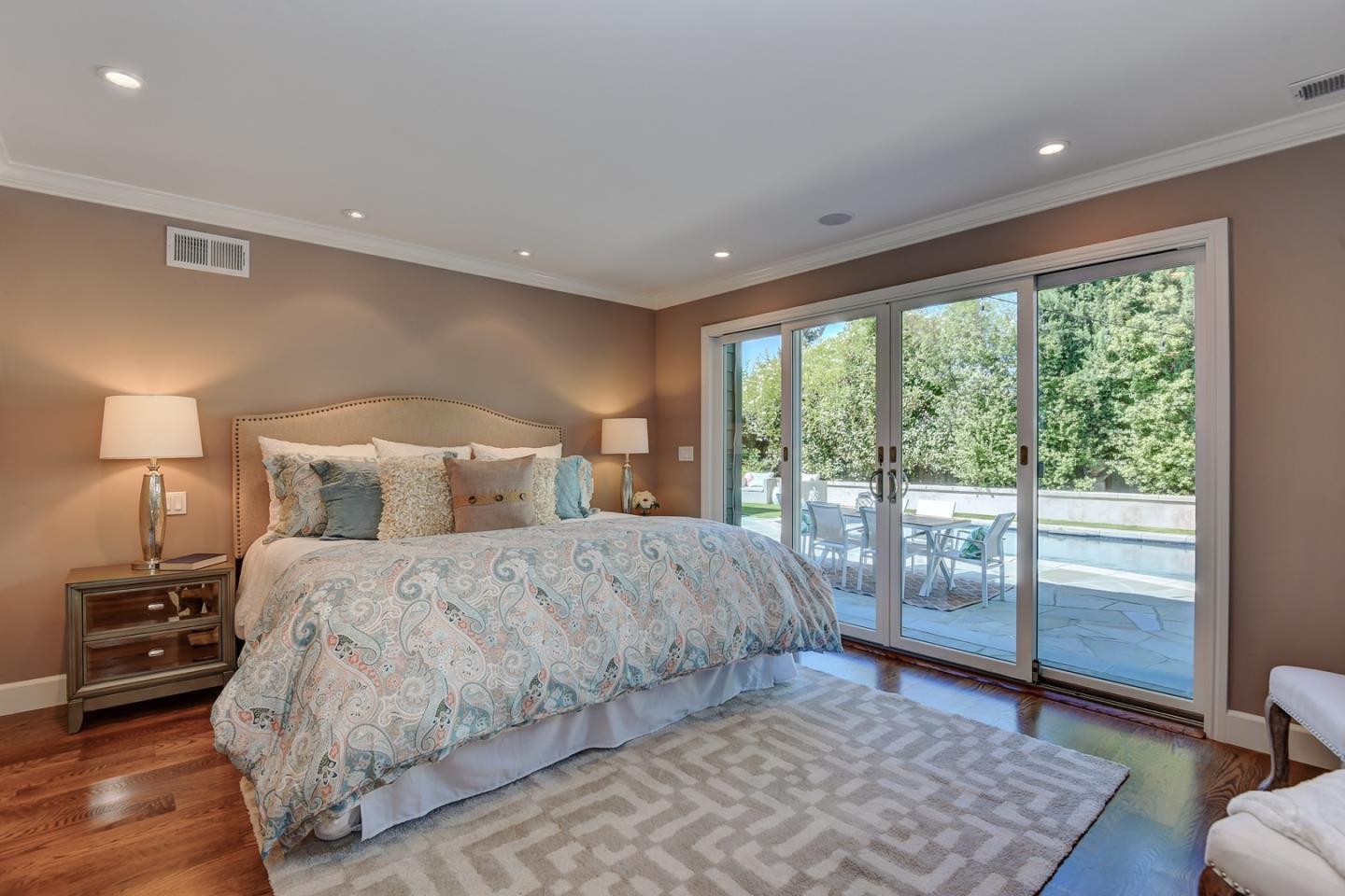 650 Chesley Avenue Mountain View, CA 94040 - Photo 20 of 32 a bedroom with a large bed and a lamp