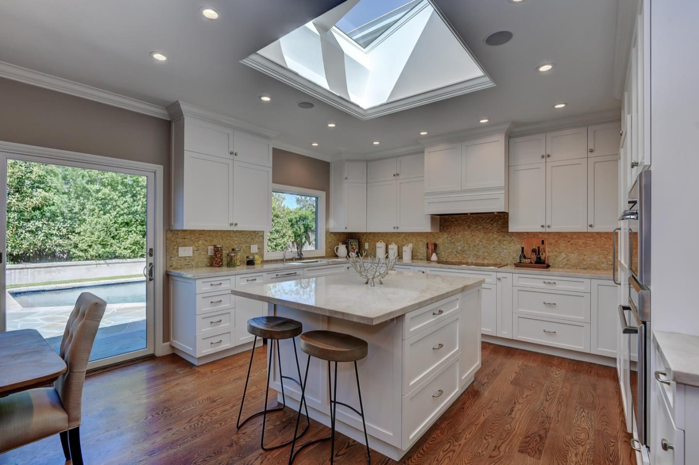 650 Chesley Avenue Mountain View, CA 94040 - Photo 10 of 32 a kitchen with white cabinets and white appliances