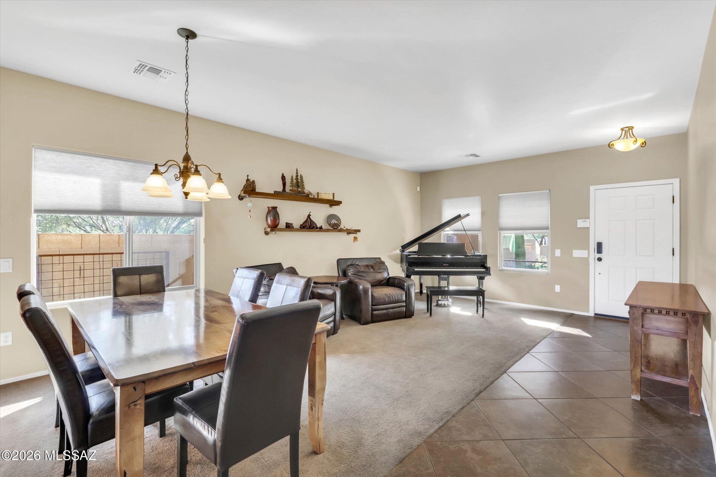 6095 South Jakemp Trail Tucson, AZ 85747 - Photo 11 of 52 a dining room with furniture and window