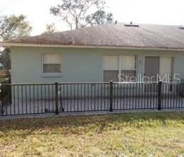 a view of a house with a wooden deck