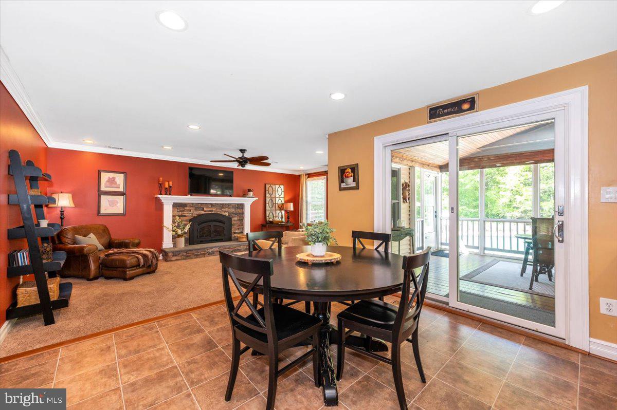 8412 Dasher Court Gaithersburg, MD 20882 - Photo 16 of 83 a dining room with furniture and a fireplace