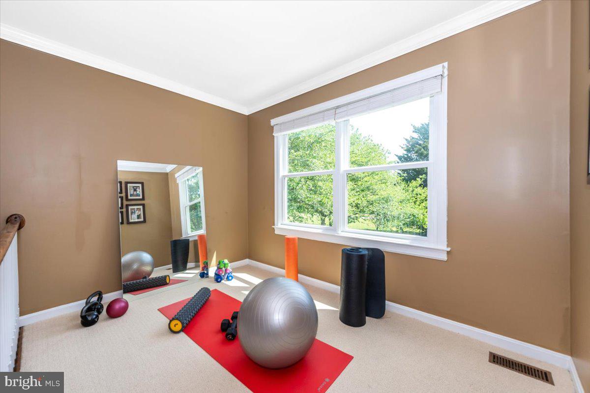 8412 Dasher Court Gaithersburg, MD 20882 - Photo 28 of 83 a bedroom with a bed and a window