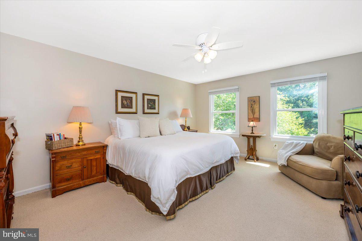 8412 Dasher Court Gaithersburg, MD 20882 - Photo 29 of 83 a spacious bedroom with a bed and couch