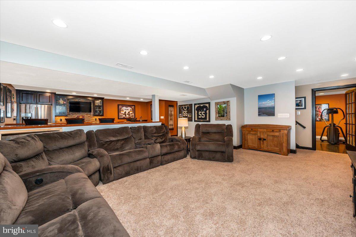 8412 Dasher Court Gaithersburg, MD 20882 - Photo 39 of 83 a living room with furniture and a flat screen tv
