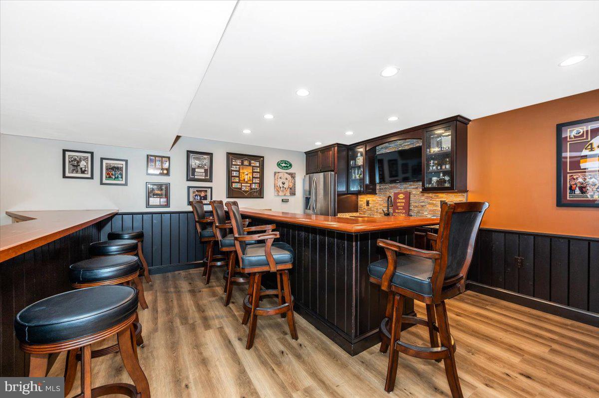 8412 Dasher Court Gaithersburg, MD 20882 - Photo 43 of 83 a dining room with furniture and wooden floor