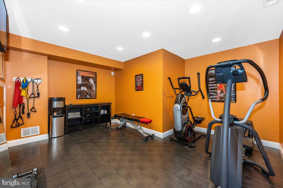 8412 Dasher Court Gaithersburg, MD 20882 - Photo 44 of 83 a view of a room with gym equipment