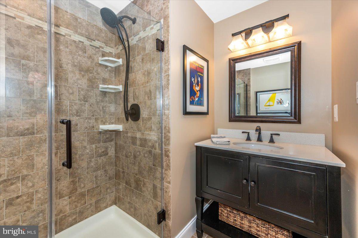 8412 Dasher Court Gaithersburg, MD 20882 - Photo 45 of 83 a bathroom with a sink and a mirror