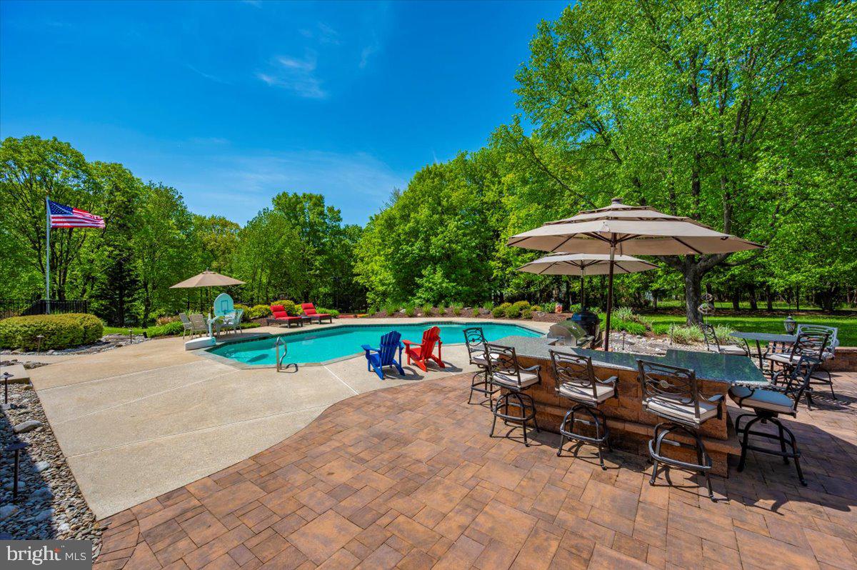 8412 Dasher Court Gaithersburg, MD 20882 - Photo 63 of 83 an outdoor space with patio and white umbrellas