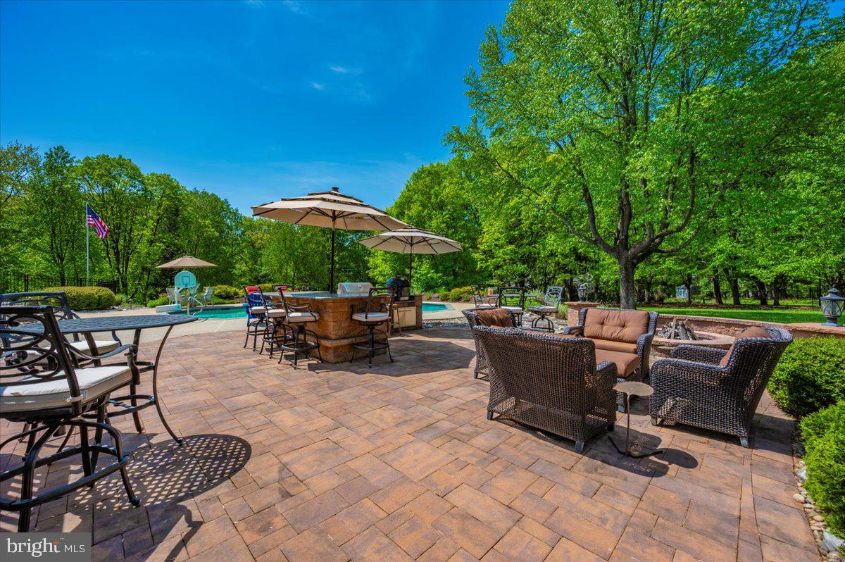 8412 Dasher Court Gaithersburg, MD 20882 - Photo 65 of 83 a view of backyard with seating space and trees