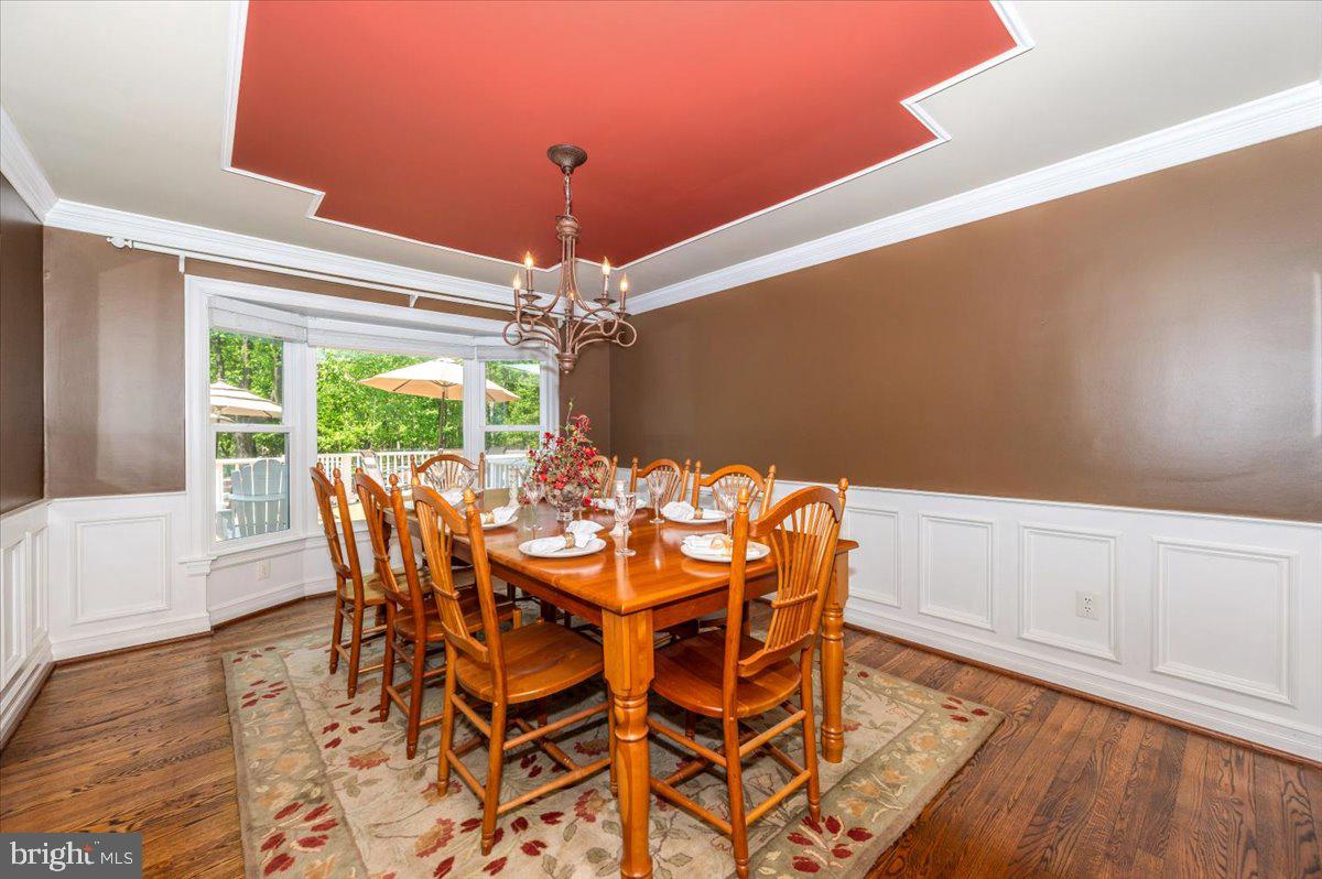 8412 Dasher Court Gaithersburg, MD 20882 - Photo 8 of 83 a view of a dining room with furniture window and wooden floor