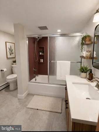 a bathroom with a bathtub and a toilet