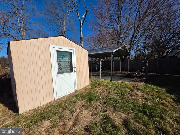 a view of backyard with large trees
