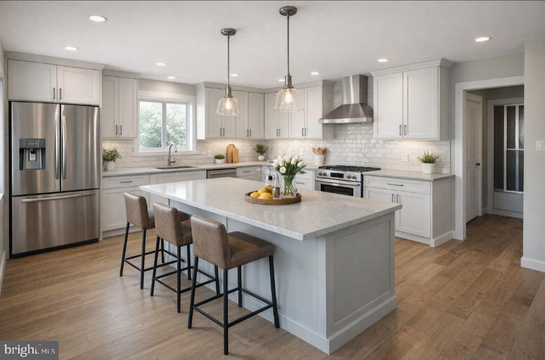 1625 5th Street Ewing, NJ 08638 - Photo 9 of 16 a kitchen with stainless steel appliances granite countertop a table chairs refrigerator and sink