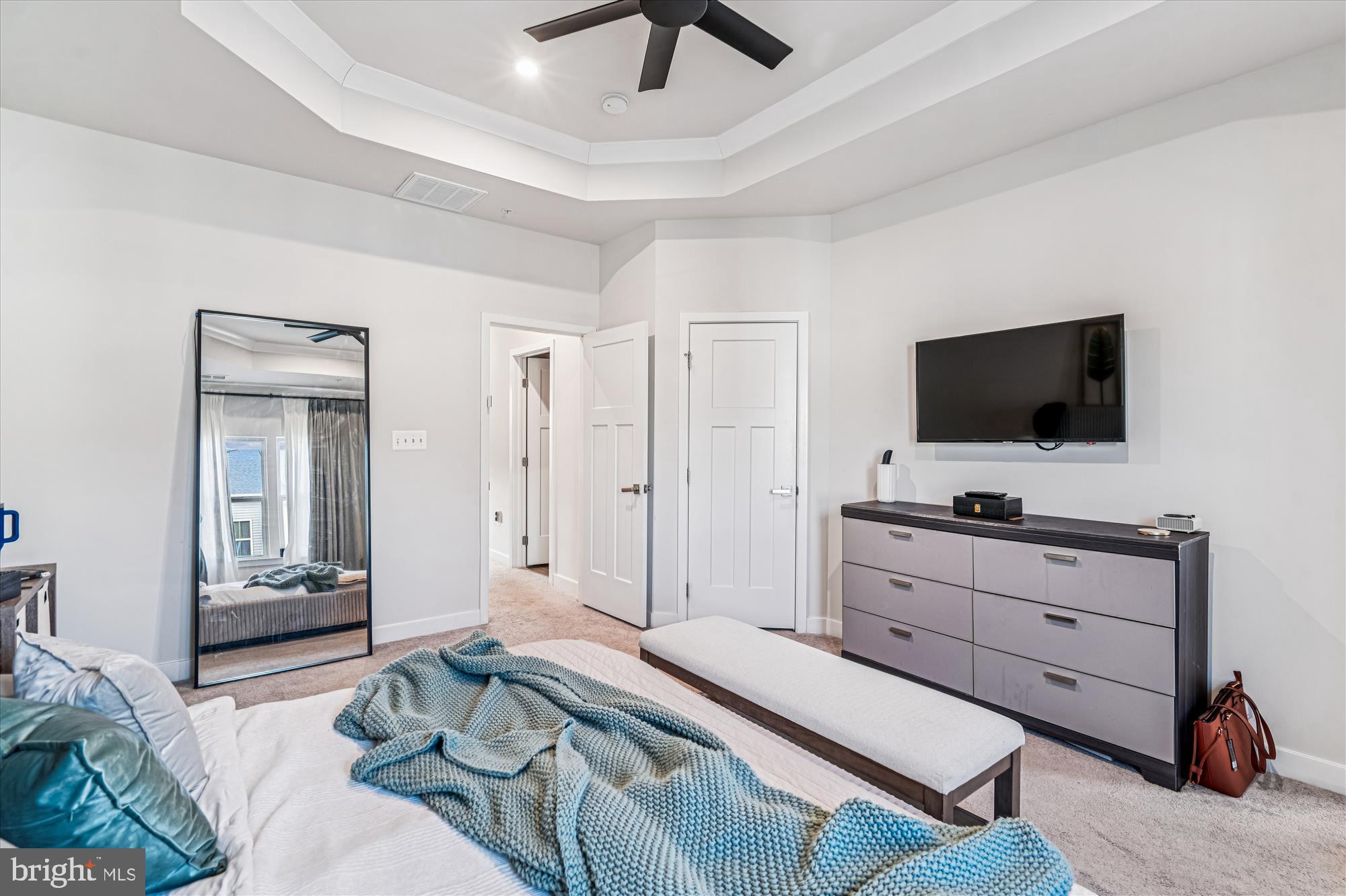 136 Brown Branch Road Laurel, MD 20708 - Photo 15 of 44 a bedroom with a bed and a flat screen tv