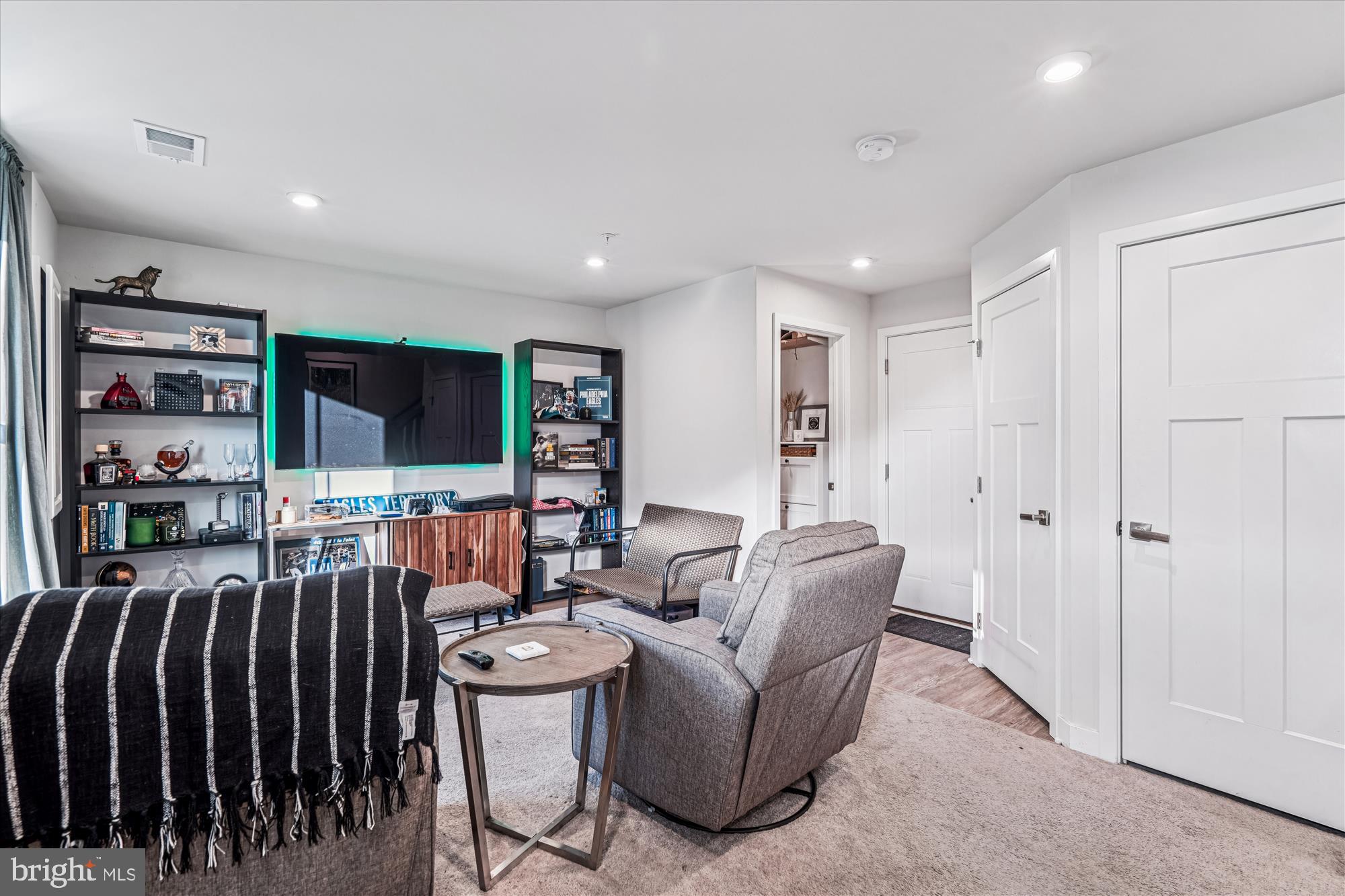 136 Brown Branch Road Laurel, MD 20708 - Photo 26 of 44 a living room with lots of furniture and a flat screen tv