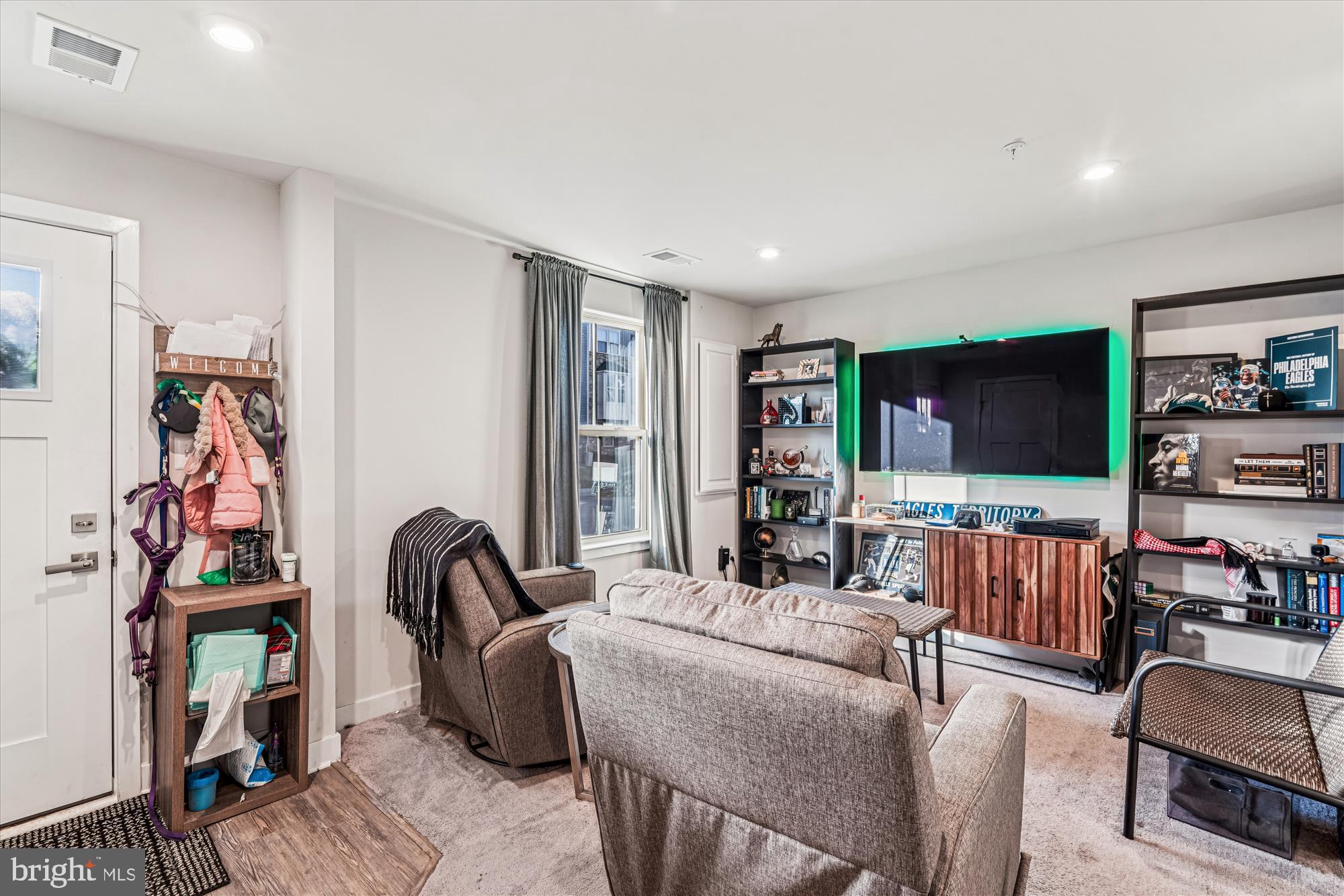 136 Brown Branch Road Laurel, MD 20708 - Photo 27 of 44 a living room with furniture and a flat screen tv