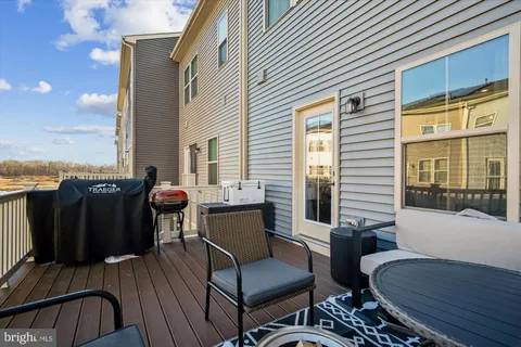 a view of a balcony with furniture and a window