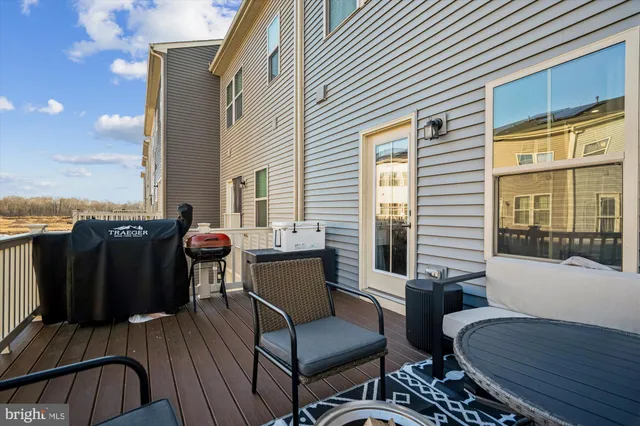 a view of a balcony with furniture and a window