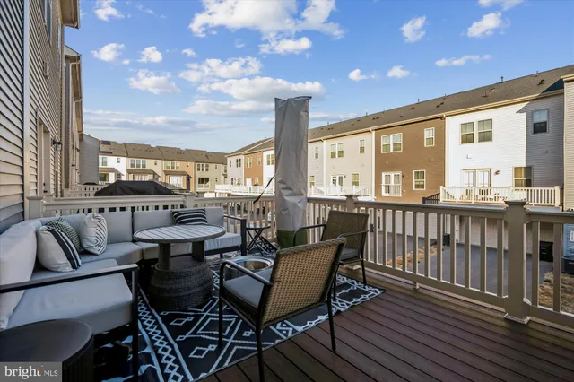 a view of a balcony with furniture and a table