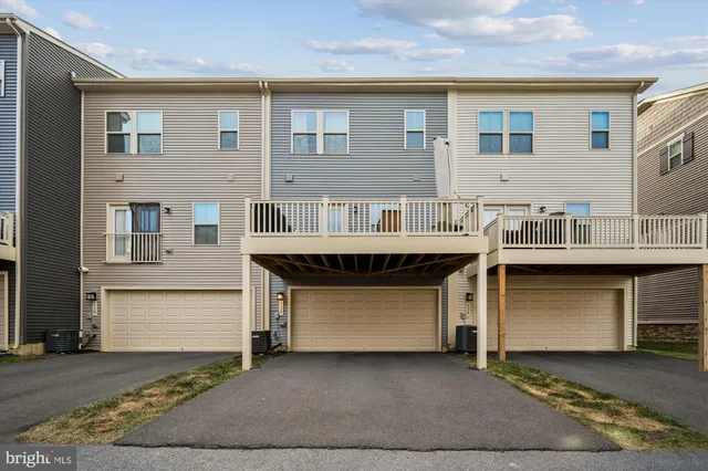 a front view of a house with a garage