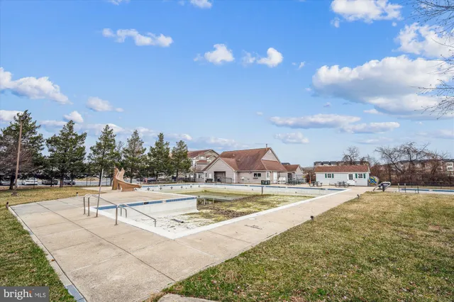 a view of a swimming pool with an outdoor seating