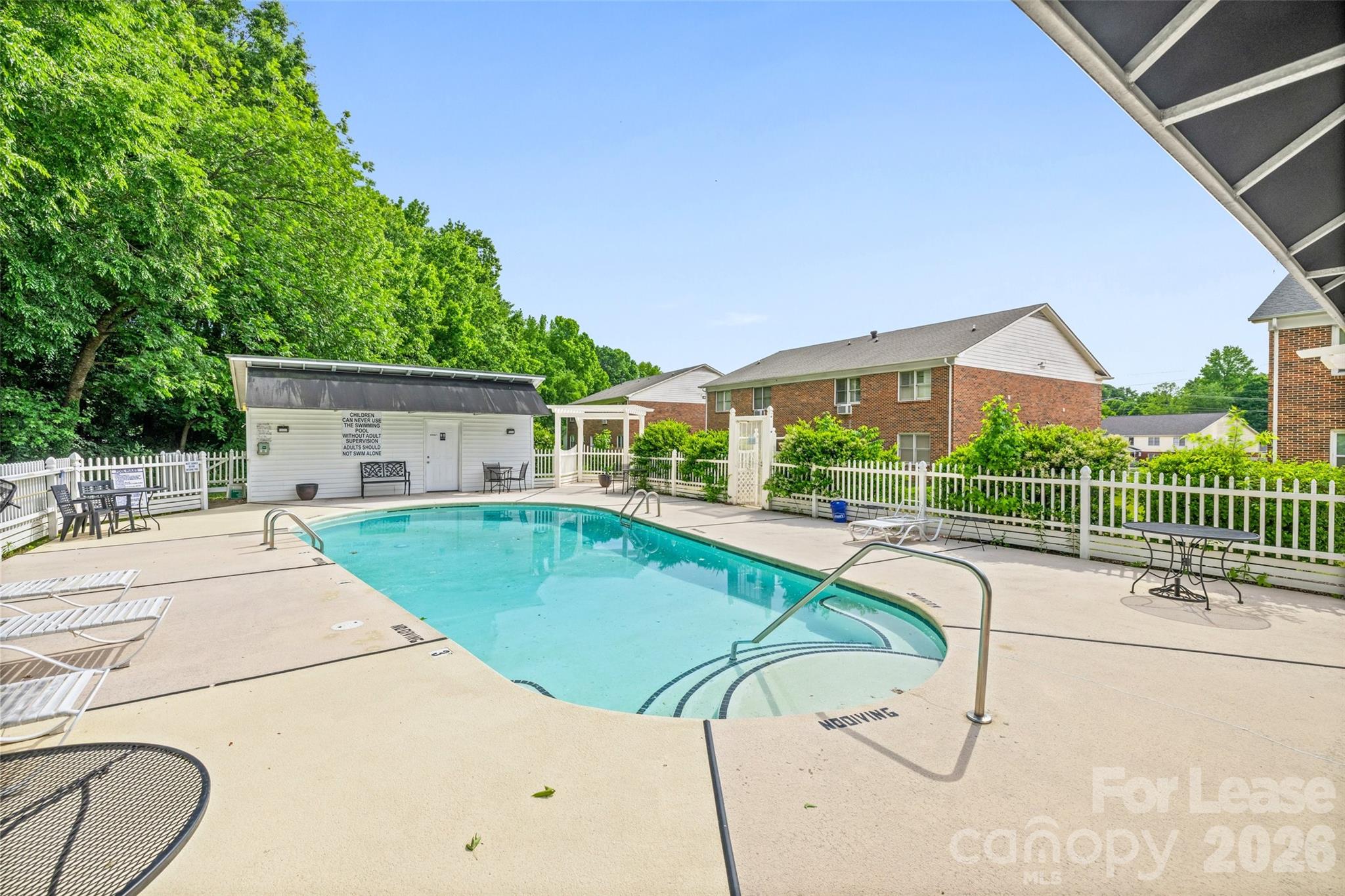 113 Stroupe Road, Unit E Gastonia, NC 28056 - Photo 30 of 33 a view of a house with a swimming pool